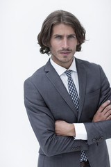 Happy young man with dark hair wearing an elegant suit