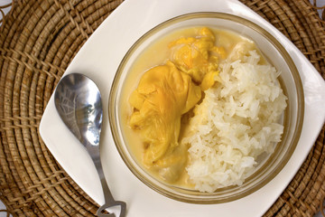 Top view, Thai dessert, durian with sticky rice in sweet coconut milk.