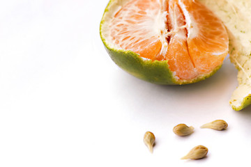 Half orange with seeds isolated on white background.