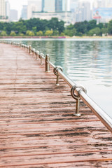 Walkroad alongside the lake in park at the middle of city, Bangkok Thailand
