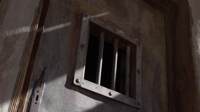 Old west jail door tilt up reveal window