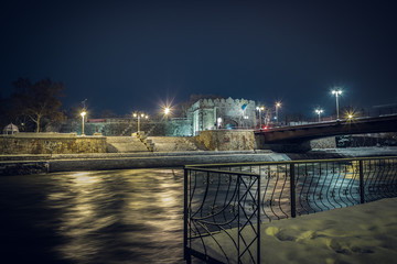 View of the ancient Fortress of Nis and Nisava river at winter night