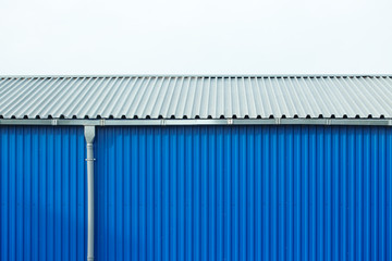 Industrial building blue sheet metal facade, abstract background
