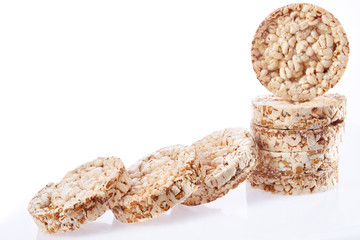 Round wheat crispbread, white background. Composition of crispbread on white background.