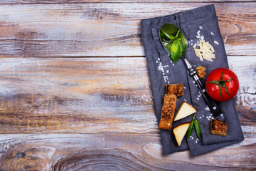 Tomato soup with pesto sauce and parmesan cheese in a ceramic cup