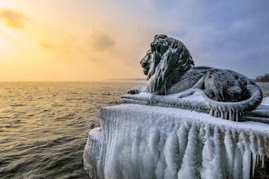 Ice-covered Bavarian Lion on a frosty winter day in Tutzing on Lake Starnberg