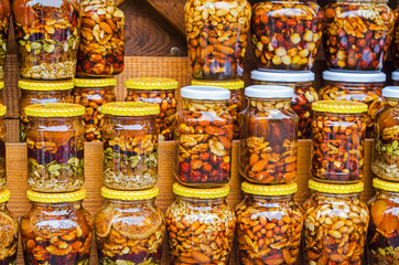 Colorful honey with fruit and nuts