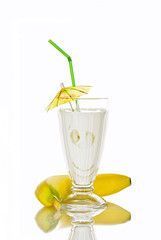  Yogurt with banana in a glass on white background, isolated. Healthy breakfast concept. closeup.