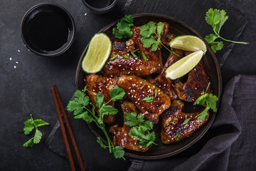 roasted teriyaki chicken wings, served with lime, cilantro and sesame seeds