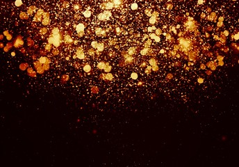 Gold bokeh isolated on black background