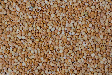 Peas on a wood background and burlap top view
