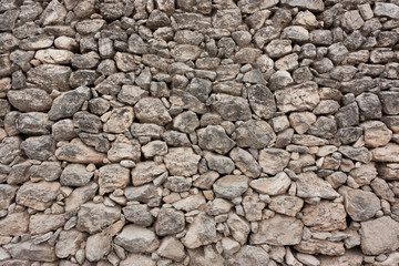  wall of rough cobblestones in a row