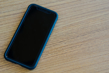 Close up the smartphone  on the vintage table