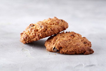 Sweet biscuits arranged in pattern on light textured background, close-up, shallow depth of field, selective focus.
