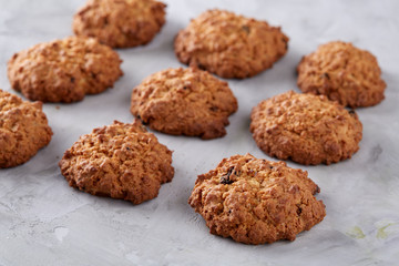 Sweet biscuits arranged in pattern on light textured background, close-up, shallow depth of field, selective focus.
