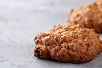 Sweet biscuits arranged in pattern on light textured background, close-up, shallow depth of field, selective focus.
