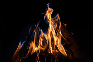 Orange and blue fire flames on black background