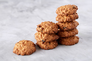 Sweet biscuits arranged in pattern on light textured background, close-up, shallow depth of field, selective focus.