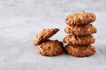 Sweet biscuits arranged in pattern on light textured background, close-up, shallow depth of field, selective focus.