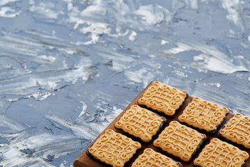 Top view close-up picture of tasty cookies on the cutting board, shallow depth of field, selective focus