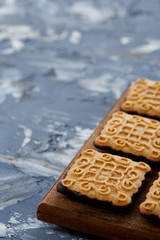 Top view close-up picture of tasty cookies on the cutting board, shallow depth of field, selective focus