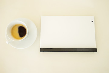 Preparing for work with tablet and coffee