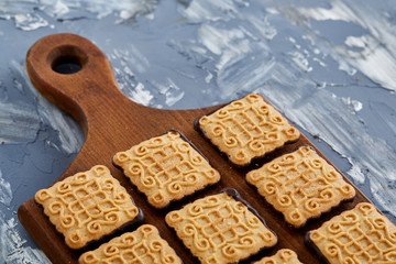 Top view close-up picture of tasty cookies on the cutting board, shallow depth of field, selective focus