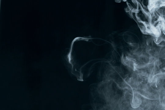 Texture of white smoke on a black background