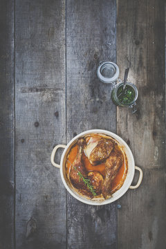 roast chicken with pesto on wooden background