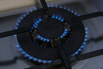 Gas burner flame at gas stove, close-up.