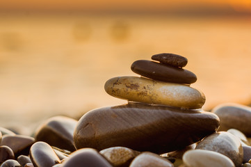 stack of zen stones on pebble beach