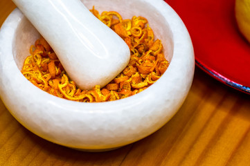 White marble mortar with the orange zest
