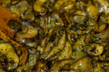 fried with onions and spices Royal mushrooms champignons in a frying pan