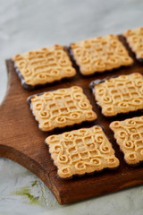 Top view close-up picture of tasty cookies on the cutting board, shallow depth of field, selective focus