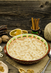 Romanian traditional food called mucenici. Eight shape made from flour, cooked and served with sugar, walnuts and cinnamon
