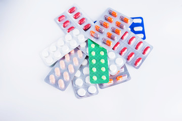 syringe and pills isolated on white