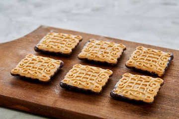 Top view close-up picture of tasty cookies on the cutting board, shallow depth of field, selective focus