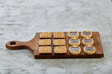 Top view close-up picture of tasty cookies on the cutting board, shallow depth of field, selective focus