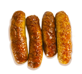 Fried sausages on white isolated background.
