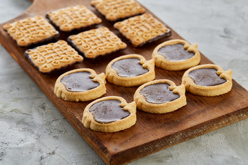 Top view close-up picture of tasty cookies on the cutting board, shallow depth of field, selective focus