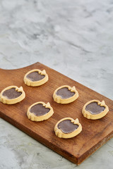Top view close-up picture of tasty cookies on the cutting board, shallow depth of field, selective focus