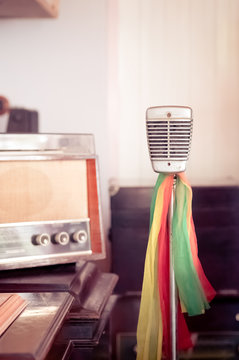 old fashion microphone with colorful ribbins