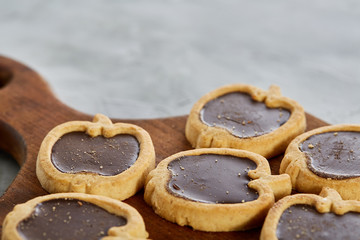 Top view close-up picture of tasty cookies on the cutting board, shallow depth of field, selective focus