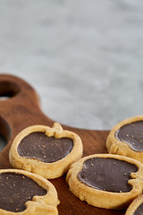 Top view close-up picture of tasty cookies on the cutting board, shallow depth of field, selective focus