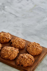 Top view close-up picture of tasty chocolate cookies on the cutting board, shallow depth of field, selective focus