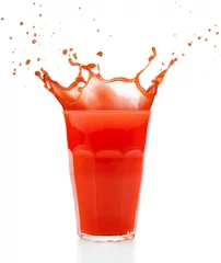 Papier Peint photo Jus red juice splashing out of a glass isolated on white
