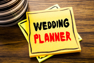 Handwriting Announcement text showing Wedding Planner. Business concept for Marriage Preparation written on sticky note paper on the wooden wood background with coffee cup