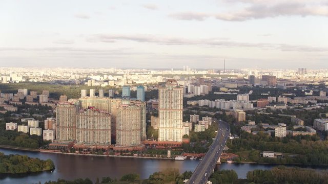 Aerial view of Moscow. Skyscrapers of housing complex Alye Parusa over Moskva River. Stroginsky bridge. Moscow, Russia. 4k