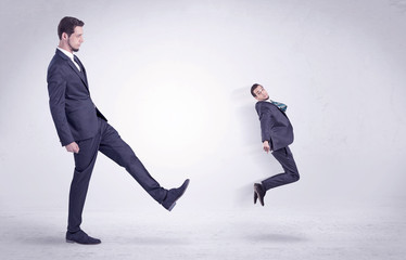 Big man kicking little himself out