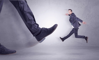 Foot kicking, businessman flying